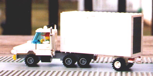 Semi Trucks A Conventional Slope Nose Tractor With Short Trailer Picture On The Right Shows Dolly For Use When Pulling Multiple Trailers